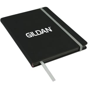 A black A5 journal with a textured cover, an elastic closure, and a ribbon bookmark. It features a logo on the front.