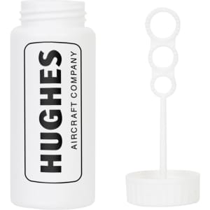 A white bottle of Miracle Bubbles with a bubble wand attached, featuring a logo on the front.