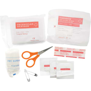 A first aid travel kit featuring white packaging, scissors, bandages, and various medical supplies in a compact arrangement.