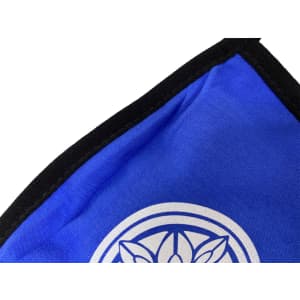 A blue cotton face mask with a black edge and a circular logo on the front.