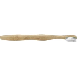 A bamboo toothbrush with a curved handle and white bristles, featuring a logo on the handle.