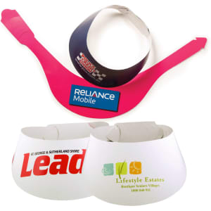 Three sun visors in pink and white, featuring various logos and branding.