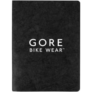 A black notebook with a textured cover featuring a logo. It has a smooth finish and blank pages inside.
