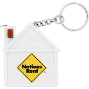 A white house-shaped keychain with a silver chain, featuring a logo on the front.