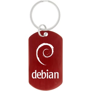 A red dog tag keychain featuring a spiral design and a logo. It has a silver keyring attached.
