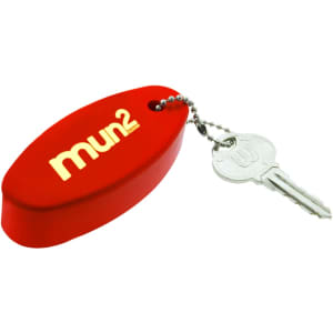 A red floating keychain attached to a silver key, featuring a logo on one side.