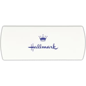 A cream-coloured bandage dispenser with a blue logo and crown graphic.