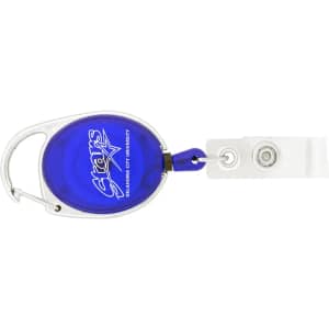 A retractable badge holder in blue with a silver clip and a clear strap for attachment. Features a logo on the front.