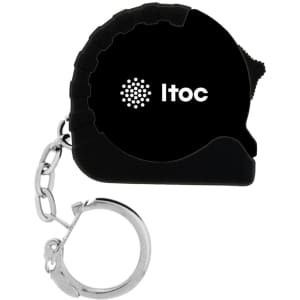 A black mini tape measure with a silver keychain attachment and a logo on the side.