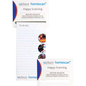A magnetic to-do list product featuring a white notepad with lined pages and a small branding label in blue and red.