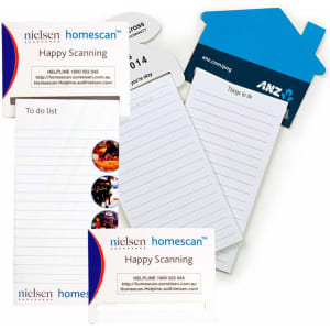 A magnetic to-do list in white, featuring lined pages and a branding logo, alongside a blue house-shaped notepad.