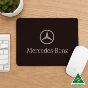A set of three mouse mats in black, white, and grey, featuring a logo on the front of the black mat.