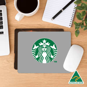 A purple mouse mat with white text reminding to keep social distance when back at work. It features a logo.