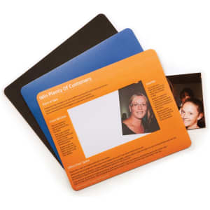 A set of three mouse mats in black, blue, and orange, featuring a photo window on the orange mat.