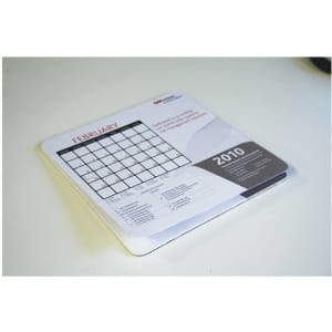 A mouse mat featuring a calendar for February 2010, predominantly white with grey accents and a logo.