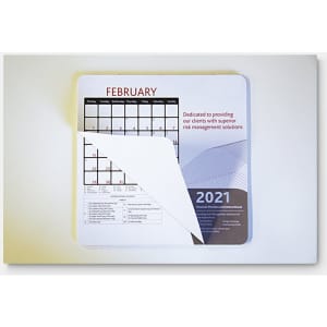 A mouse mat featuring a calendar layout for February 2021, with a white background and a logo in the corner.