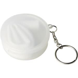 A white, reusable silicone straw stored in a round carrying case with a keychain attachment.