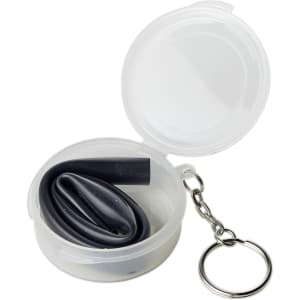 A black reusable silicone straw inside a clear, round case with a keychain attachment.