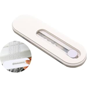 A white smartphone strap with a transparent section and a small circular button, designed for phone stands.