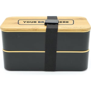 A two-layer lunch box in black and natural wood, featuring a secure strap and a branding area on the lid.