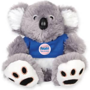 A grey plush koala with white ears and paws, wearing a blue shirt featuring a logo.
