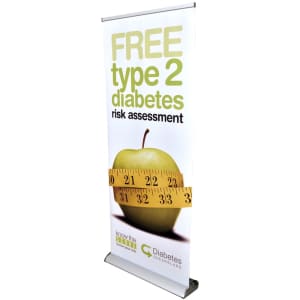 A roll-up banner featuring an apple and a measuring tape, predominantly in green and white, with a logo at the bottom.