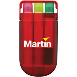 A set of three highlighters in pink, green, and yellow, housed in a red carrying case with a logo.