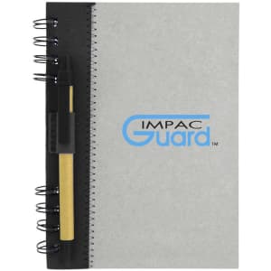 A grey recycled journal book with a black cover, featuring a spiral binding and a pen attached.