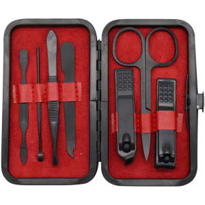A black manicure set with red lining, containing scissors, clippers, tweezers, and various nail tools, presented in a compact case.