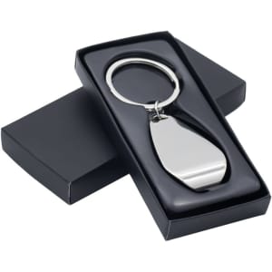 A metallic silver keychain displayed inside a sleek black box with a lid. The box has a smooth finish.
