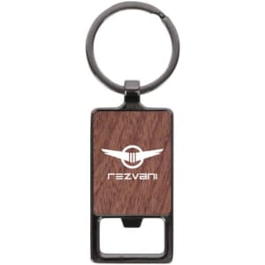 A rectangular keychain with a wood-like texture and a metal keyring. It features a logo on the front.