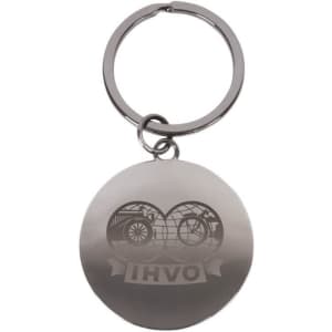 A silver round keychain featuring a logo, attached to a metal ring.