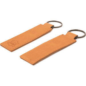 A tan recycled leather keyring featuring a metal ring for attachment and a logo embossed on one side.