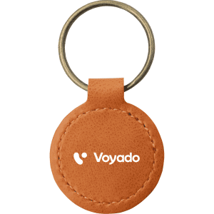 A round keyring made from recycled leather in a tan colour with a metal ring and a branding logo.