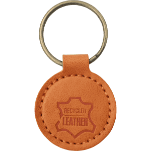 A round, tan recycled leather keyring attached to a metal ring. Features a logo.