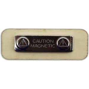 A rectangular wooden badge in beige with a silver magnetic clasp and a caution label.