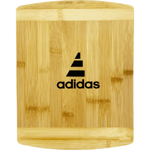 A bamboo cutting board featuring a sleek design with a logo. The board has a natural finish with a smooth surface.