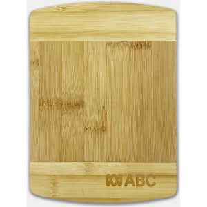 A bamboo cutting board featuring a smooth surface with a rectangular shape and a small logo on one side.