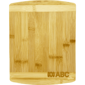 A bamboo cutting board with a smooth surface and rounded edges, featuring a logo in one corner.