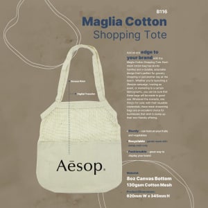 A cotton shopping tote in cream with mesh panels and a logo, featuring sturdy handles and a spacious interior.