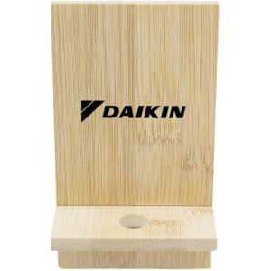 A bamboo phone stand with a simple design, featuring a slot for the device and an engraved logo.