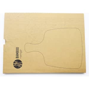 A bamboo cheese board and knife set in eco-friendly packaging, featuring a simple design and natural tones.