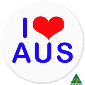 A 56mm button badge featuring a red heart and the text "I AUS" in blue on a white background, with a logo.