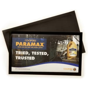 A black bar mat featuring a promotional graphic with a logo and text for a cattle product.