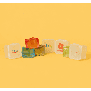 Jelly Cube sensory toys in various colours, featuring a promotional logo on one cube against a bright yellow background.
