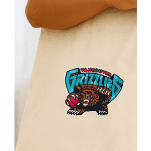 A natural tote bag featuring an embroidered Vancouver Grizzlies logo in blue, black, and brown.