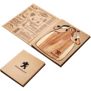 A wooden acacia cheeseboard with a knife set, presented in a brown packaging featuring a logo and design elements.