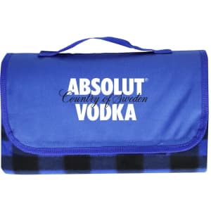 A blue picnic blanket with a checkered pattern, featuring a logo on the front. It has a convenient carry handle.