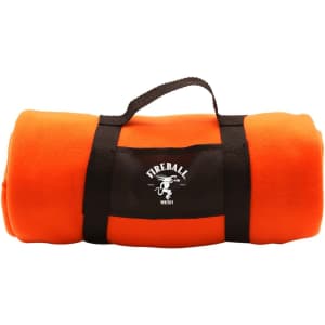 An orange blanket rolled up with a black strap and a logo.