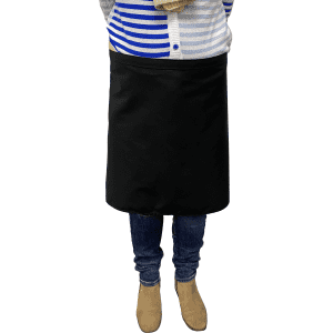 A black waist apron worn by a person, paired with a striped blue and white top and jeans.
